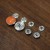 Silver with orange enamel 