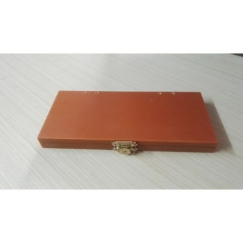 Folded leather strop with jewelers rouge